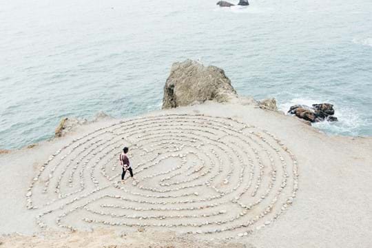Woman walking through a prayer labyrinth