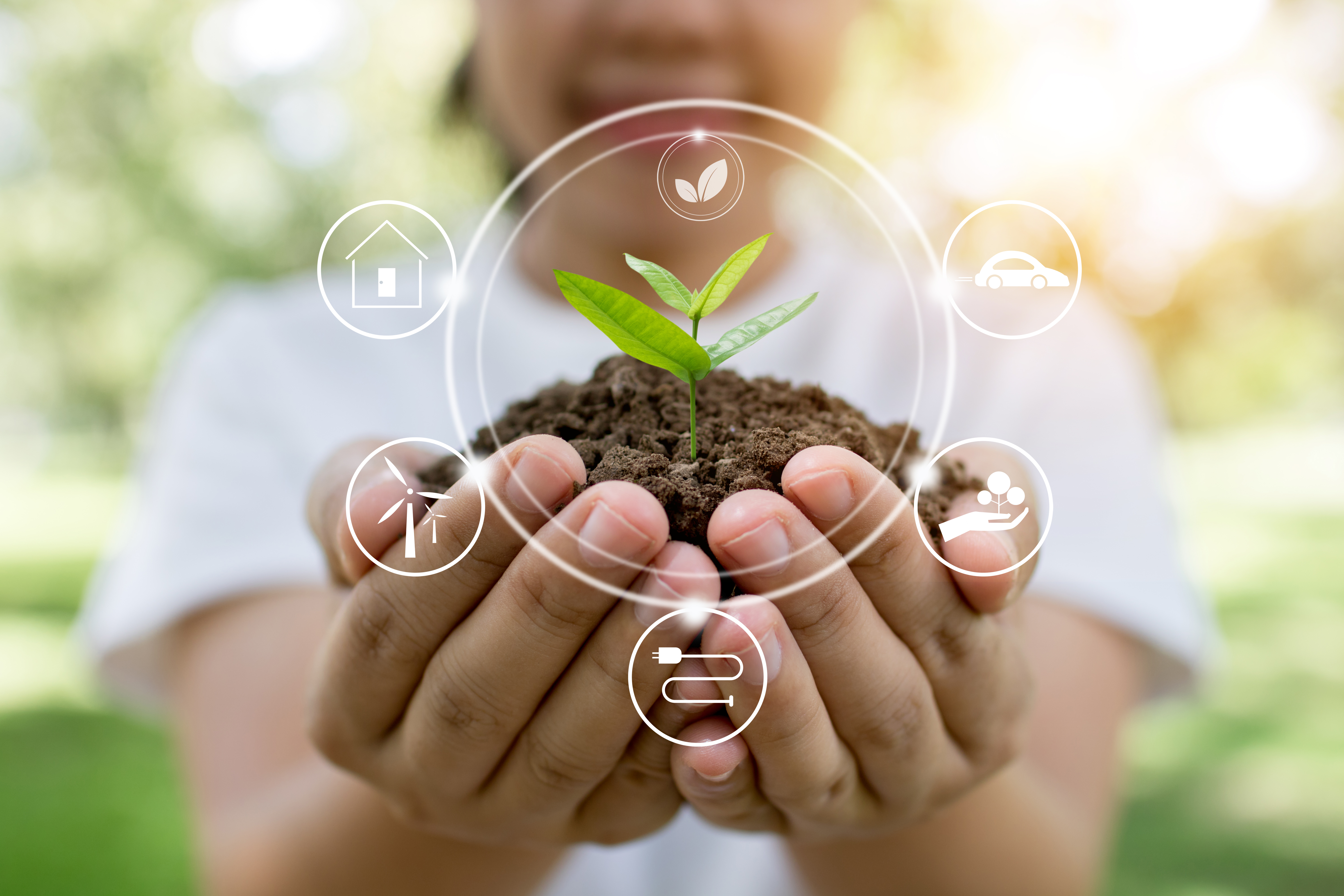 Girl holding plant with eco icons